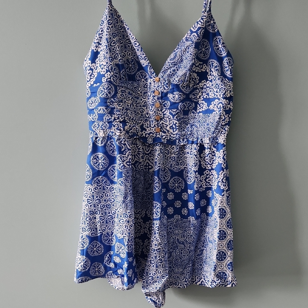 Blue and White One Piece with Plunging V-Neckline and Intricate Pattern